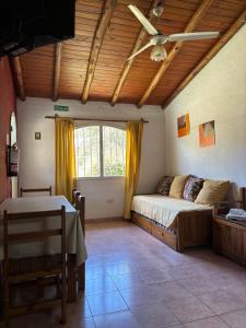 a bedroom with a bed and a ceiling fan at Complejo Alto Paraiso in Villa Cura Brochero +62 photos