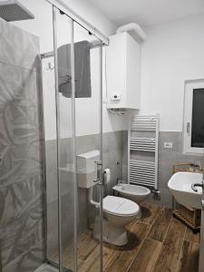 a bathroom with a toilet and a shower and a sink at Cà par durmì in Gravellona Toce +34 photos
