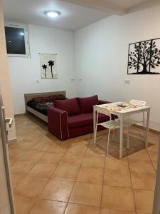 a living room with a couch and a table at Studio Centre Ville in Tarbes