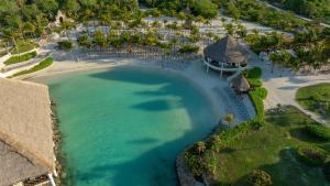an aerial view of a beach with a resort at Occidental at Xcaret Destination - All Inclusive in Playa del Carmen
