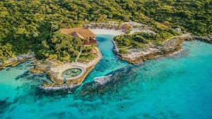 an aerial view of a house on a island in the water at Occidental at Xcaret Destination - All Inclusive in Playa del Carmen +153 photos