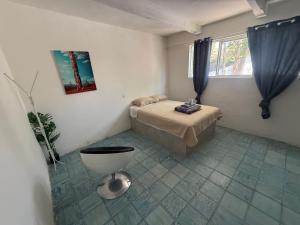 a bedroom with a bed and a toilet in it at La Vecindad in Querétaro +36 photos