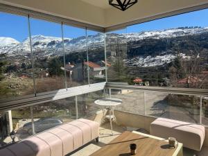 a large living room with a large glass window at Cozy appartment in hrajel in Dir‘alī