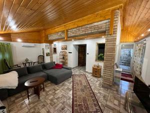 a living room with a couch and a table at Non stop apartman in Kaposvár