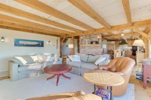 a living room with a couch and a table at Oceanaire in Dennis