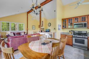 a kitchen and dining room with a table and chairs at Pleasant Point in Wellfleet