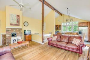 a living room with a couch and a fireplace at Pleasant Point in Wellfleet