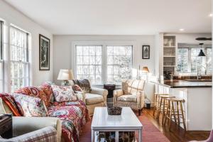 a living room with a couch and a table at Sunny Days in Brewster