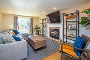 a living room with a couch and a fireplace at Cod Hollow in Provincetown