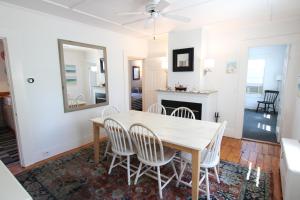 a dining room with a table and chairs at High Tide Lower Level in Provincetown