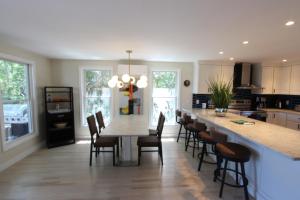 a kitchen with a long table and chairs in a kitchen at The Viewpoint in Provincetown