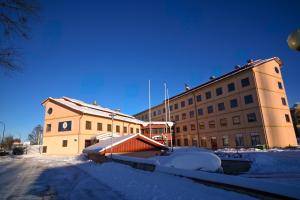 a building is covered in snow in front at Hotel Mälarporten in Västerås