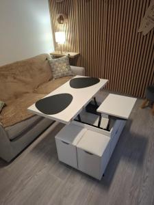 a coffee table in a living room with a couch at Charmant studio Thionville in Thionville +3 photos