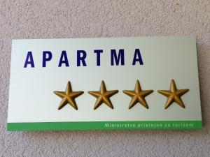 four stars on a sign with the words a pentmite at Apartment mit Balkon by Interhome in Gorje