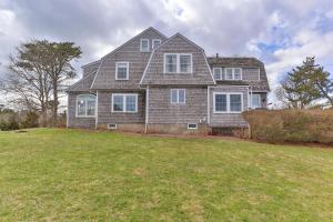 a large house with a large yard with a grass field at Aweigh We Go in Chatham