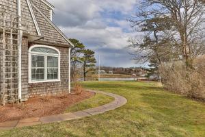 a house with a walkway next to a yard at Aweigh We Go in Chatham