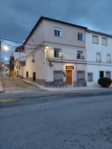 a building on the side of a street at Alojamiento Rural - El Rocin in Elche de la Sierra