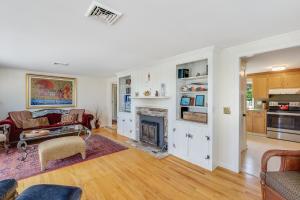 a living room with a fireplace and a couch at Le Petit Château in Dennis +27 photos