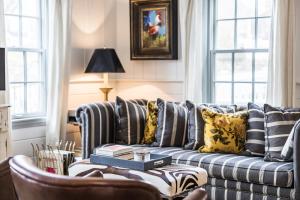 a living room with a couch and a chair at The Cook House in Provincetown