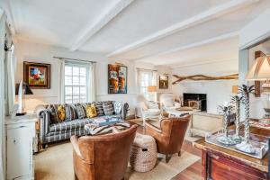 a living room with a couch and a table at The Cook House in Provincetown