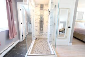 a shower with a glass door in a room at The Viewpoint in Provincetown +10 photos