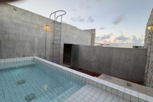 a swimming pool on top of a building at Casa Piedra Villa in Cancún