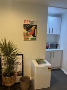 an office with a refrigerator and a counter and a kitchen at Nelson Escape in Nelson +8 photos