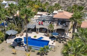 an aerial view of a house with a swimming pool at The Fairway Villa in San José del Cabo