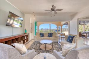 a living room with couches and a table at The Fairway Villa in San José del Cabo