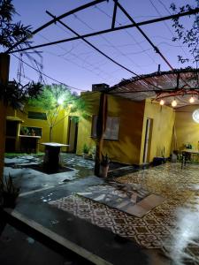 a courtyard of a house at night at Alojamiento San Nicolas in La Rioja +3 photos