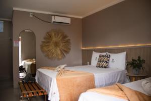 a hotel room with two beds and a fan at DECK DOS LENÇÓIS pousada in Barreirinhas +99 photos