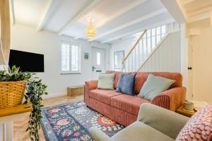 a living room with a couch and a tv at 2 Bed in Wadebridge oc-m32567 in Wadebridge