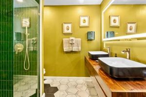 a bathroom with a sink and a shower at The Railyard NOLA - Adult Only, Clothing Optional Pool in New Orleans +99 photos