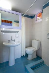 a bathroom with a toilet and a sink at Summer House Louisa in Lygia +59 photos