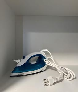 a blue and white computer mouse with a cord at Flats com Temática Grega na Praia de Aruana | Atena Flats in Aracaju