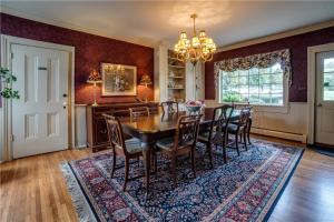 a dining room with a table and chairs at Oak & Anchor Inn in Penn Yan