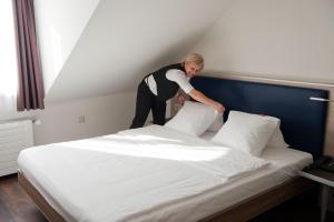 Posteľ alebo postele v izbe v ubytovaní Hotel Alexander Zurich Old Town