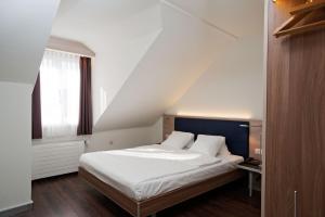Posteľ alebo postele v izbe v ubytovaní Hotel Alexander Zurich Old Town