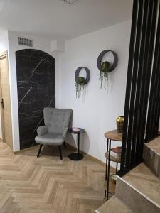 a living room with a chair and a table at La costière in Nice +14 photos