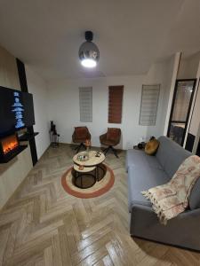 a living room with a couch and a table at La costière in Nice