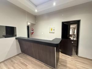 an empty room with a counter in a room at Hotel Haití in San Miguel de Tucumán