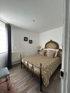 a bedroom with a large bed in a room at Maison Charmante in Vervins