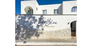 a white building with a sign that reads bliven at D'Blue Búzios Hotel Boutique in Búzios