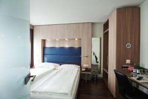 Ein Bett oder Betten in einem Zimmer der Unterkunft Hotel Alexander Zurich Old Town