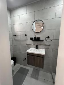 a bathroom with a sink and a mirror at Bijoc 01 Apartment in San Felipe de Puerto Plata +31 photos
