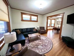 a living room with a couch and a table at Casa Lentini in Omaha