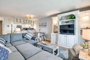 a living room with a couch and a table at Ocean Access & Balcony: Surfside Beach Condo in Myrtle Beach
