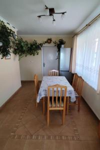 a dining room with a table and chairs at Apartment Ferienwohnung by Interhome in Tihany