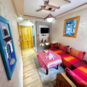 a living room with a couch and a table at Akchour waterfalls in Akchour