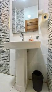 a bathroom with a sink and a mirror at Le Cocooning Mermoz-Batrain in Dakar +22 photos